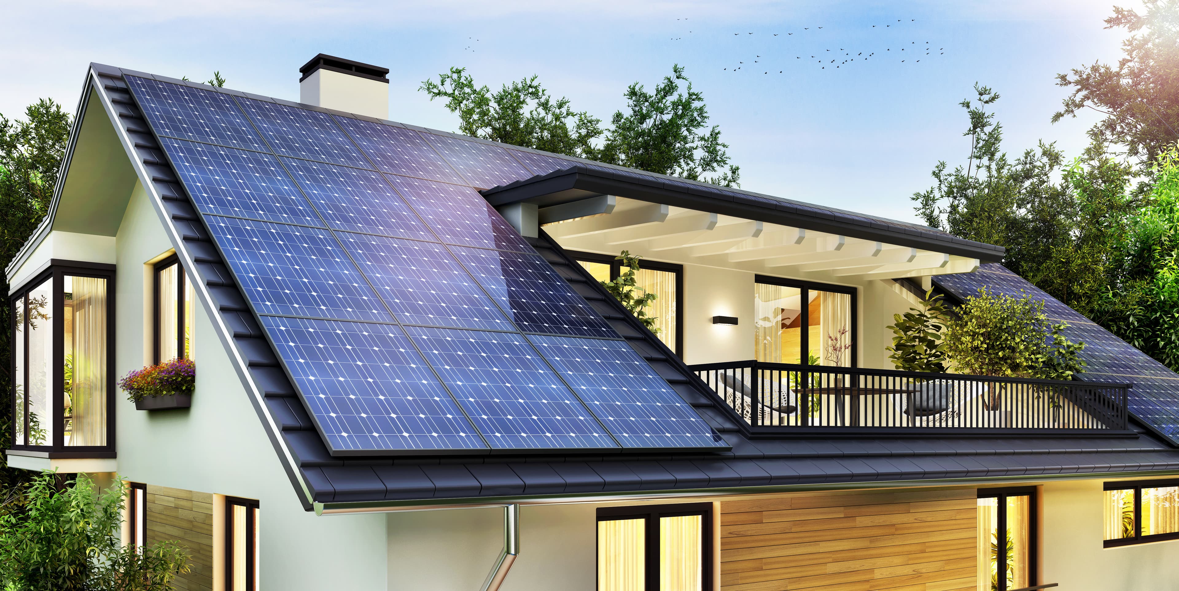 Casa con paneles solares en techo y vegetación